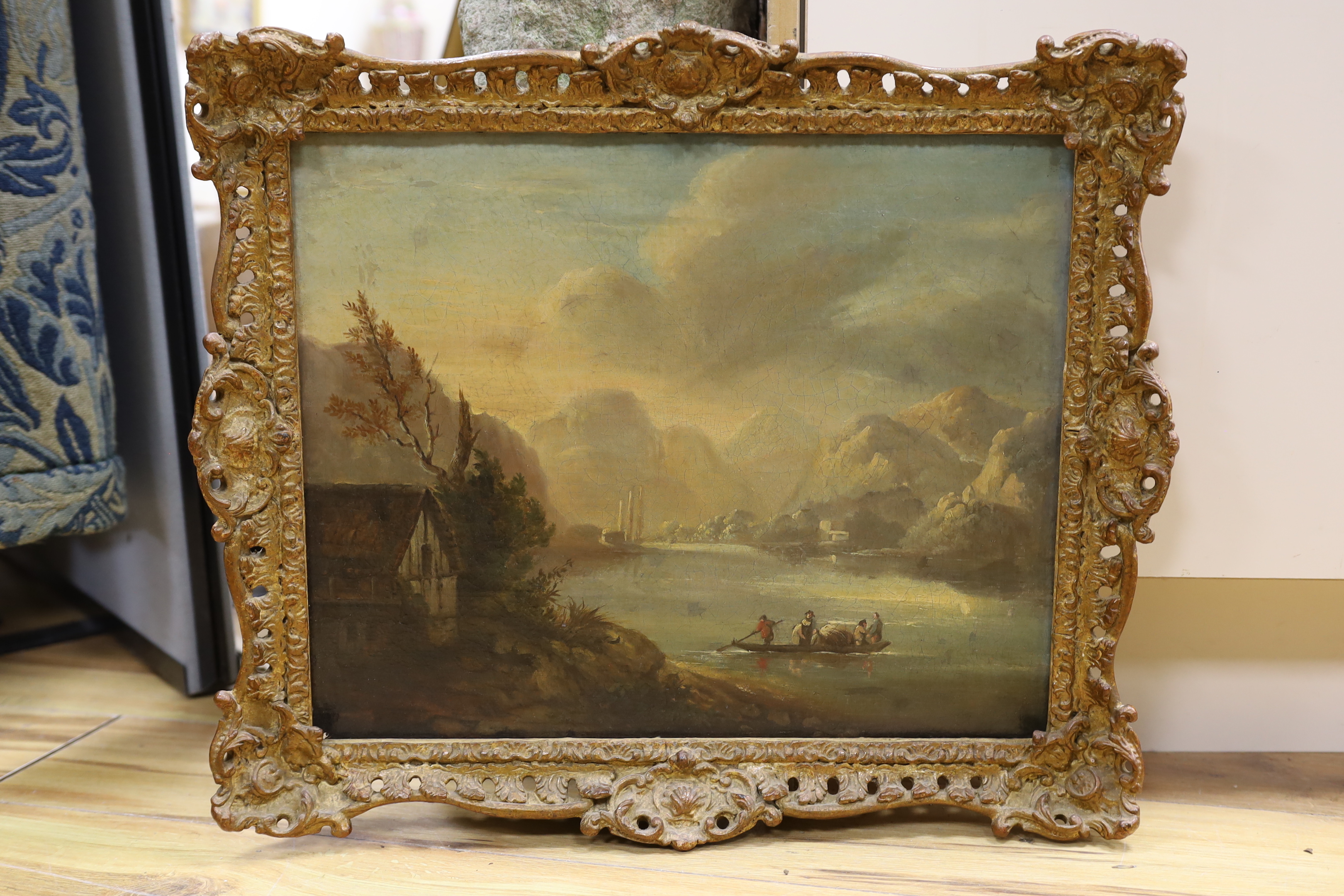 19th century English school, oil on canvas, Mountainous lake scene with figures in a boat, 35 x 43cm
